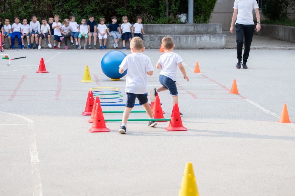 Group of children working on polygon. Sport school