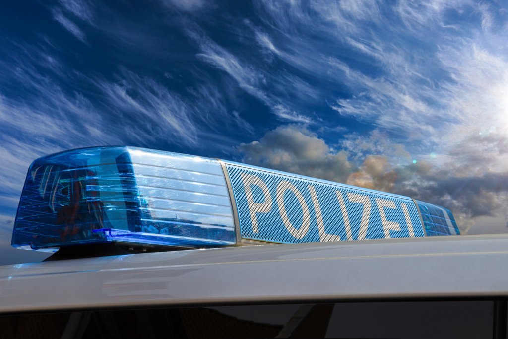German police car against a cloudy sky