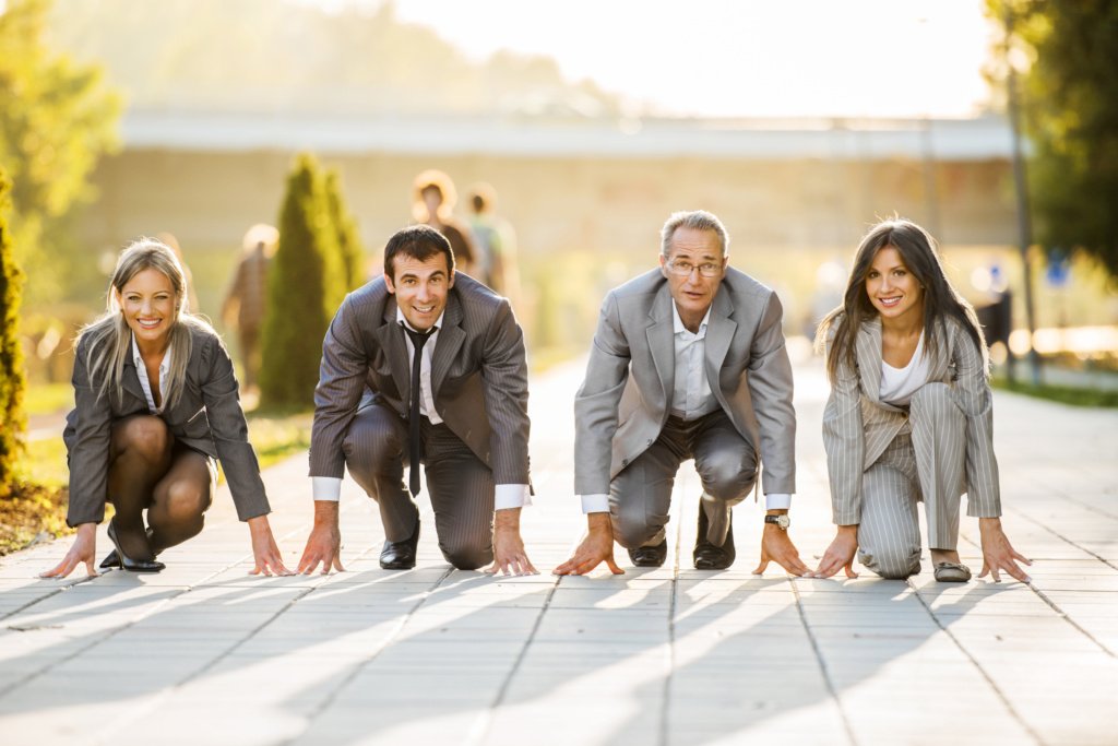 Businesspeople on a starting line, ready to run